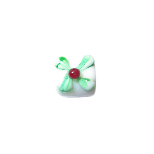 White glassbead with green and red