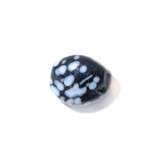 Black glass bead with white dots