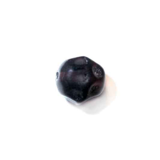 Black, round glass bead with dents like a football