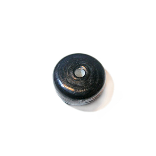 Black, round glass disc