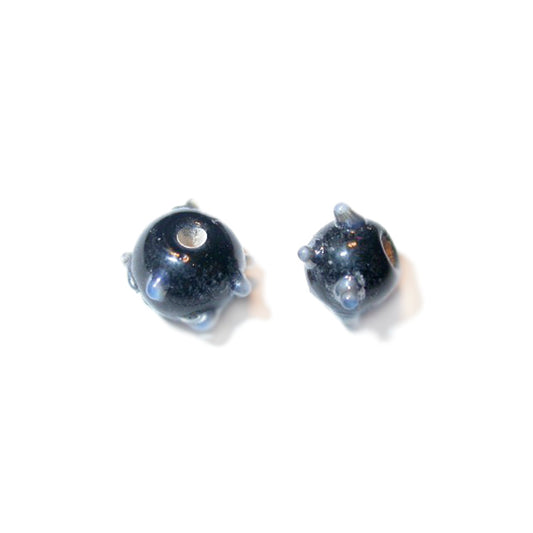 Little black glass bead with grey dots