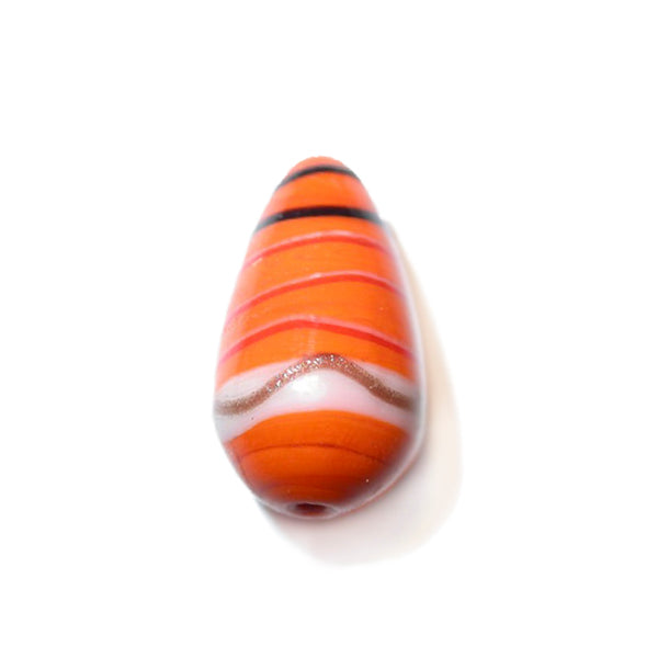 Orange glass bead painted with black, red and golden stripes