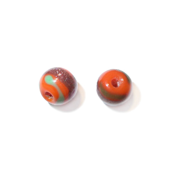 Orange, round glass bead painted with green, gold and red