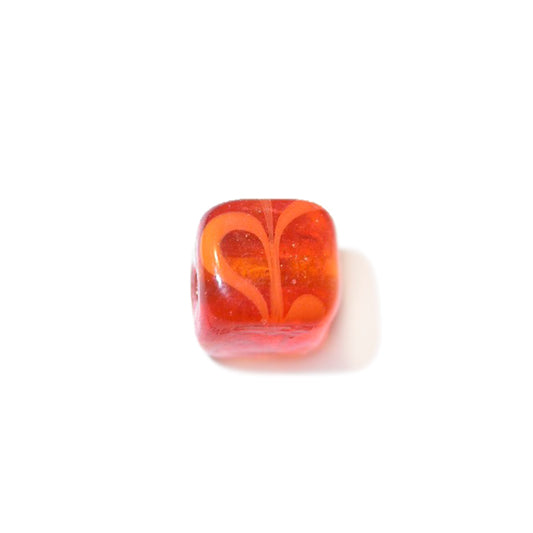 Orange, square glass bead with dark orange spots