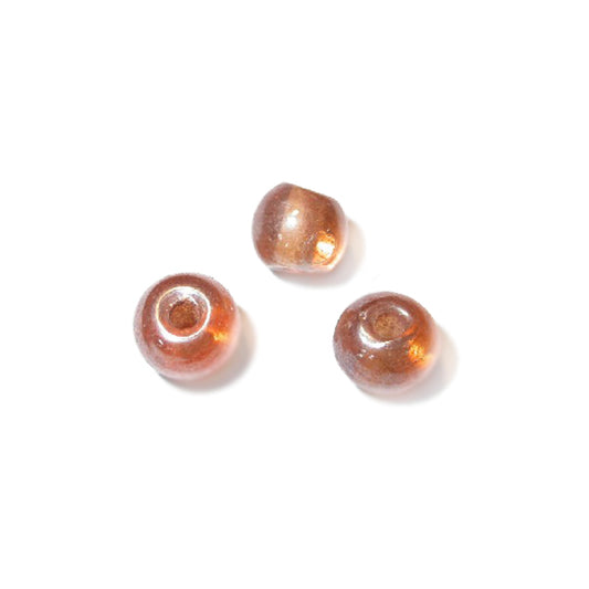 Little orangebrown glass bead with gloss