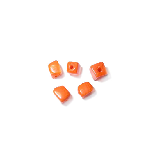 Little orange square form glass bead