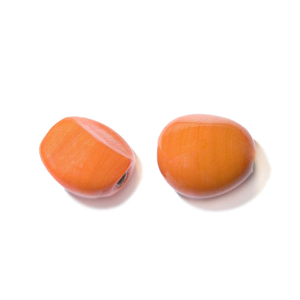 Orange glass bead with corners