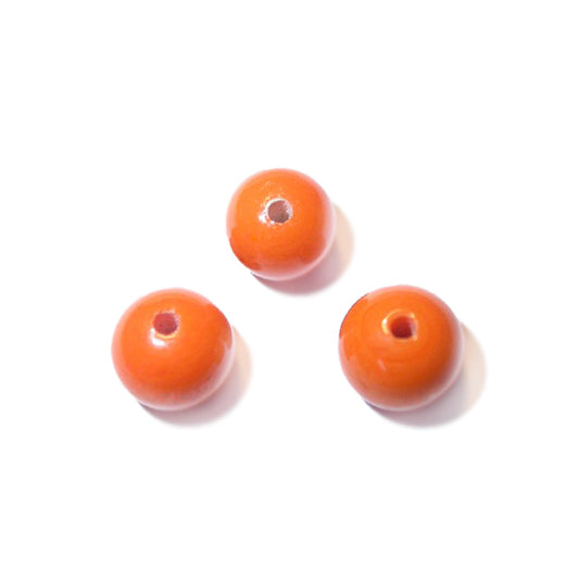 Orange round glass bead