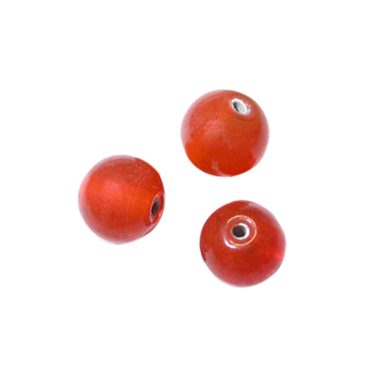 Orange round glass bead