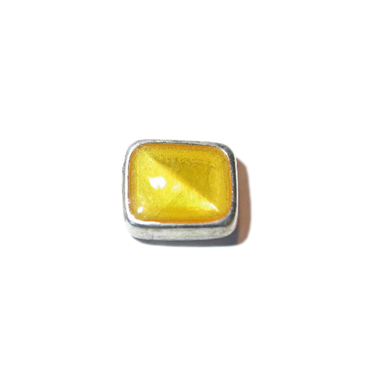 Square metal bead with yellow epoxy