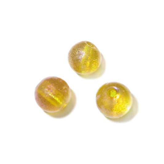 Yellow glass bead with luster