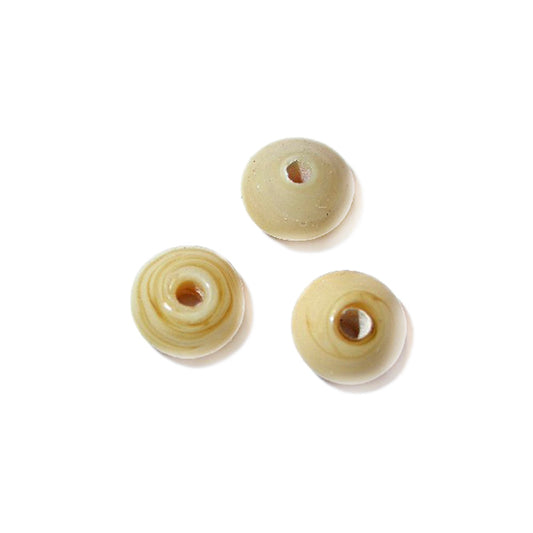 Beige, little discusform bead made of glass