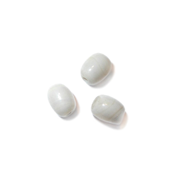 Lightbeige oval glass bead