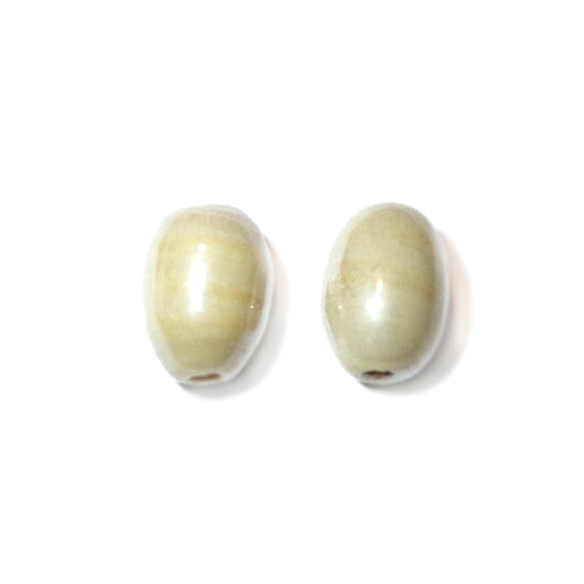 Lightbeige, oval bead made of glass