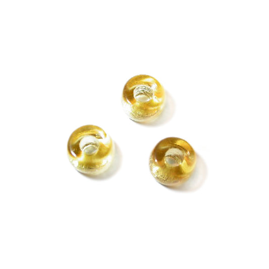 Small yellow glass bead