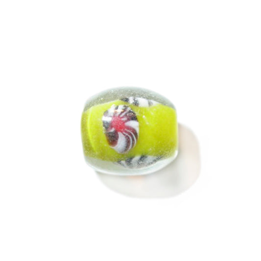 Transparent glass bead with yellow and marble effect inside