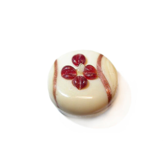 Beige glass bead with red decoration