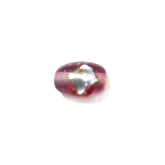 Pink glass bead with a silver decoration