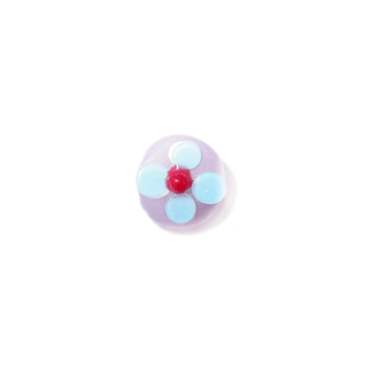 Pink, flat glass bead with white, blue and red dots forming a flower together