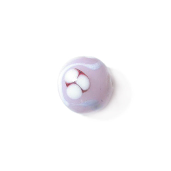 Pink glass bead decorated with lila and white