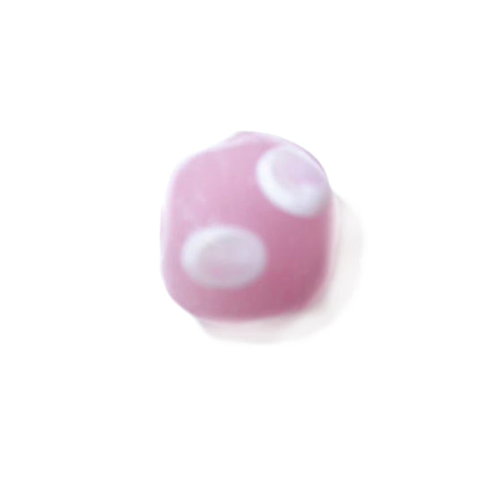 Pink glass bead with very light pink dots