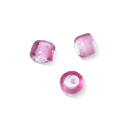 Pink glass bead with white inside