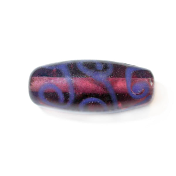 Oblong purple glass bead with blue decoration