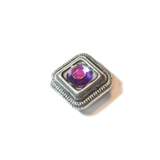 Metal bead with purple rhinestone