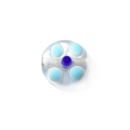 Transparent glass bead with lightblue and dark dots