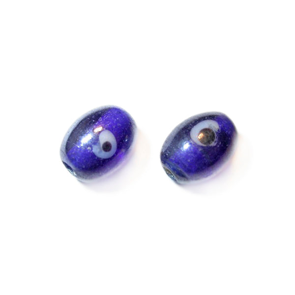 Blue glass bead with white dot