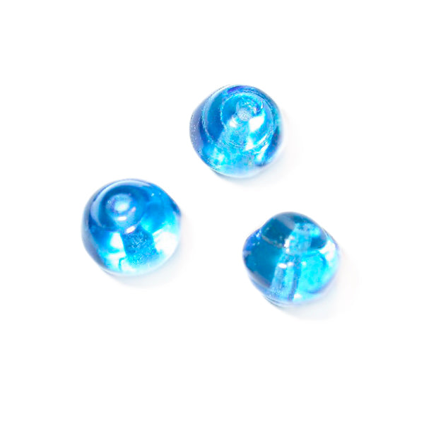 Blue glass bead with a litlle twist on both sides