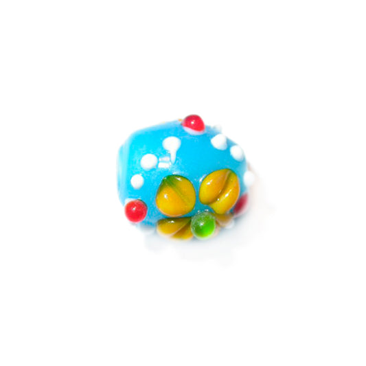 Blue glass bead with withe, yellow, red and green dots