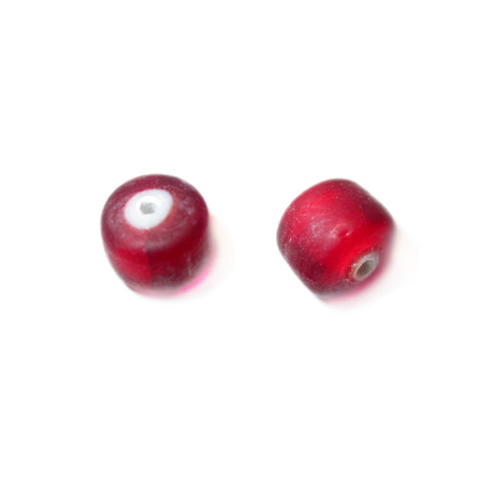 Red glass bead with white inside