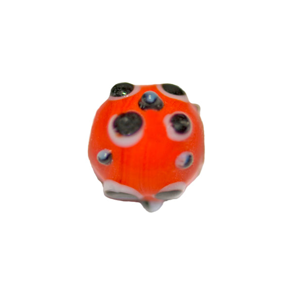 Round red glass bead with black and white dots