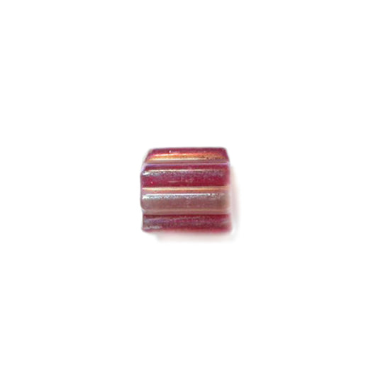 Glass bead with one half red and one half transparent red