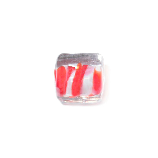 Square, transparent glassbead with red and white inside