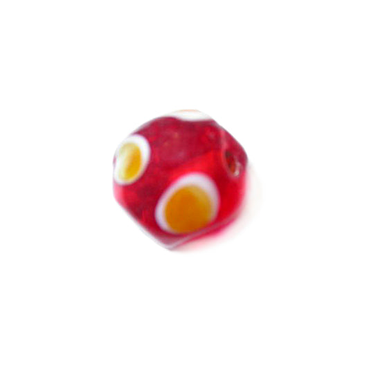 Red glass bead with yellow dots