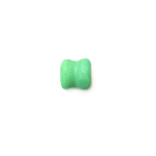 Green diabolic glass bead