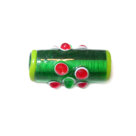 Green oblong glass bead with red and green dots