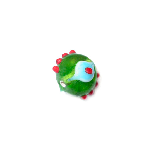 Green handmade glassbead with red dots