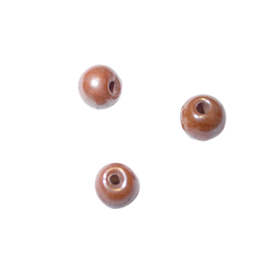 Brown round glass bead