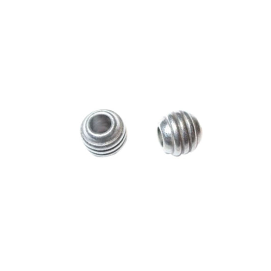 Little silver colored metal bead with stripes