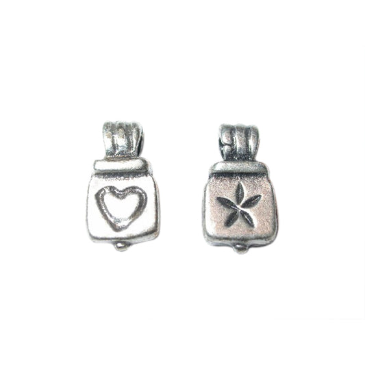 Silvercoloured charm made of metal