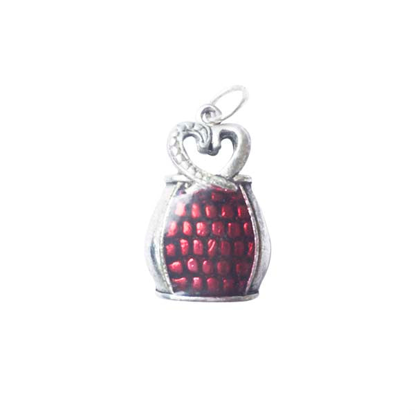 Bag charm made of metal with red epoxy